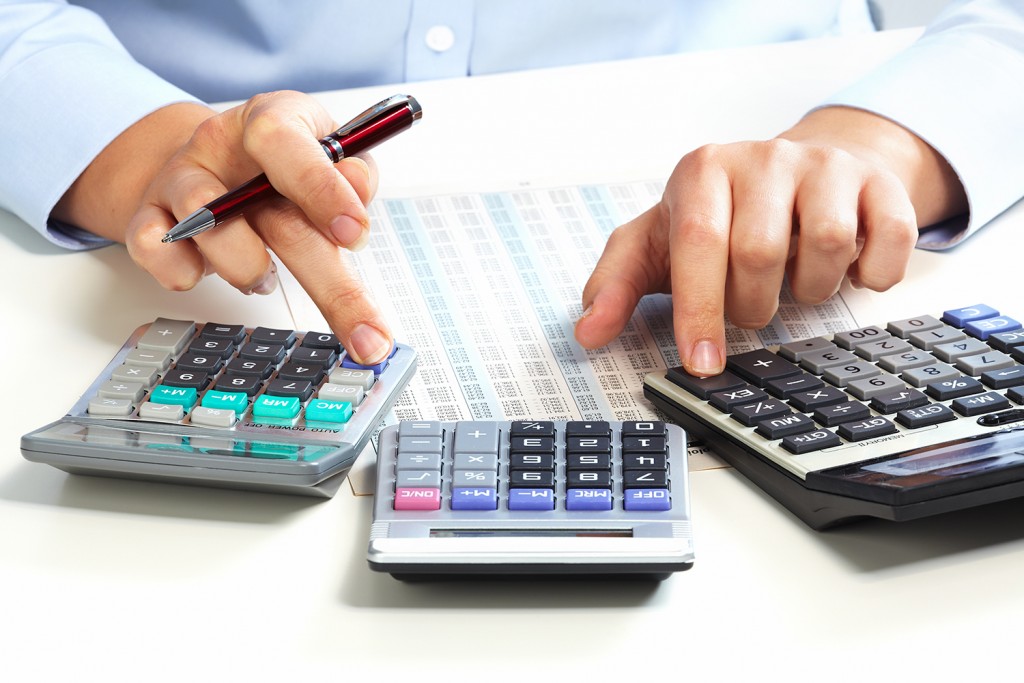 Hand with calculator.